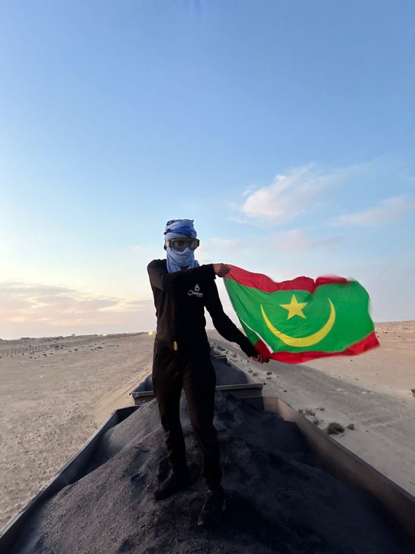 Mauritanian desert train carrying iron ore across Sahara dunes